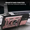 A rose gold and black phone case with a ring stand is shown in a close-up shot, with a laptop and headphones blurred in the background. Produktbild-Vorschau