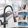 A black kitchen faucet with a pull-out sprayer is shown, demonstrating its features. Náhľad obrázku produktu