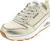A single gold Skechers sneaker is shown from a side-angle on a white background. Voir les images du produit
