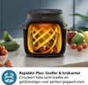A Philips air fryer is shown with a cutaway view revealing its heating element and airflow system, surrounded by fresh vegetables. Náhľad obrázku produktu