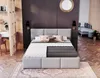 A modern bedroom with a bed, desk, and couch in the background. Produktbild-Vorschau