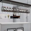 A modern kitchen or bar area with a hanging wine rack filled with wine bottles and glasses. Náhľad obrázku produktu