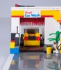A Lego model of a Shell car wash with a yellow car inside. Podgląd zdjęcia produktu
