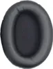 A close-up of a black headphone earpad. Produktbild-Vorschau
