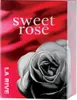 A close-up of a perfume box with a rose design. Podgląd zdjęcia produktu