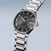 A close-up studio shot of a men's wristwatch against a gradient light gray background. Náhled obrázku produktu