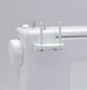 Close-up of a white sewing machine with a double spool holder attachment. Produktbild-Vorschau