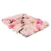 A close-up, angled view of a floral wall panel made of artificial flowers in various shades of pink and white, set against a white background. Podgląd zdjęcia produktu