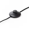 A close-up shot of a black foot switch for a lamp, with a black cable extending from it. Produktbild-Vorschau