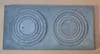 A flat lay of a cast iron stove top plate with two sets of concentric circles. Anteprima dell’immagine prodotto