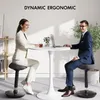 A man and woman are sitting at a round table with laptops, working in an office setting. Náhled obrázku produktu