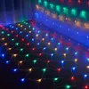 A net of colorful LED lights is spread across a dark floor and up a wall, creating a festive atmosphere. Produktbild-Vorschau