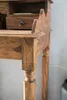 A close-up view of a wooden desk. Produktbild-Vorschau