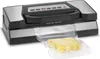 A vacuum sealer machine with a piece of cheese in a vacuum bag. Anteprima dell’immagine prodotto
