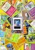 A collage of various Pokemon trading cards, with a central image of a digital illustration of a blue Pokemon character on a screen. Podgląd zdjęcia produktu