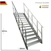 A metal staircase with metal grating steps and railings, shown against a white background. Produktbild-Vorschau