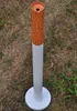 A cigarette-shaped ashtray standing on a grassy area. Produktbild-Vorschau