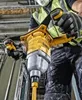 A construction worker is using a DeWALT mixer to mix materials. Podgląd zdjęcia produktu