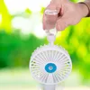 A hand is refilling a spray bottle that is attached to a portable fan. Produktbild-Vorschau