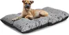 A dog lying on a dog bed. Voir les images du produit