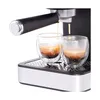 Close-up of an espresso machine brewing coffee into two glasses. Produktbild-Vorschau
