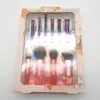 A set of makeup brushes in a clear plastic package with a decorative outer box. Anteprima dell’immagine prodotto