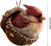 A decorative ornament of a bird nestled in a hollowed-out acorn. Produktbild-Vorschau