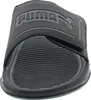 A close-up, front-facing view of a black Puma slide sandal. Produktbild-Vorschau