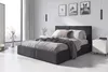 A modern bedroom with a large upholstered bed as the central focus. Produktbild-Vorschau