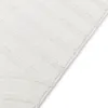 A close-up view of a white rug with a ribbed texture. Anteprima dell’immagine prodotto