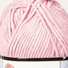 A close-up view of a ball of pink yarn. Podgląd zdjęcia produktu