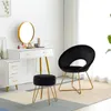 A black velvet stool and chair are placed in front of a white vanity table with a gold-framed mirror. Podgląd zdjęcia produktu
