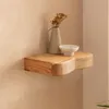 Wandregal Akazie Massivholz mit Schublade in Gesamtansicht an der Wand montiert, dekorativ mit Vase und Schale bestückt. Voir les images du produit