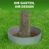 A tree trunk is surrounded by a circular metal border on a grassy lawn, with text overlay. Produktbild-Vorschau
