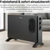 A black electric convector heater is shown in a living room setting, with text overlay describing its features. Produktbild-Vorschau