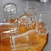 Several clear glass tumblers are arranged on a wooden surface. Náhled obrázku produktu