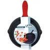 A black cast iron frying pan with a red silicone handle grip, presented on a white background with packaging and food imagery. Produktbild-Vorschau