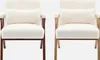 Two identical white fluffy armchairs with wooden frames are shown side-by-side against a white background. Produktbild-Vorschau