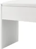 A close-up view of a white stool. Náhľad obrázku produktu
