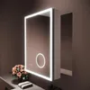 A lit bathroom mirror cabinet with a bouquet of flowers on a shelf below. Náhled obrázku produktu