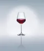 A single wine glass filled with red wine, presented on a reflective surface against a gradient background. Produktbild-Vorschau