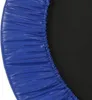 A close-up view of the edge of a blue trampoline mat with a black surface visible. Podgląd zdjęcia produktu