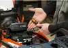 A person is shown connecting a CTEK battery charger to a motorcycle. Produktbild-Vorschau