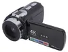 A black camcorder is shown against a white background, with its screen open. Podgląd zdjęcia produktu