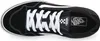 A top-down view of a black Vans sneaker with white laces. Voir les images du produit