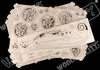 A stack of wooden model kit pieces, featuring gears and intricate designs, laid out on a black background. Voir les images du produit