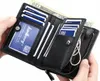 A person's hands are holding open a black leather wallet, revealing its contents. Podgląd zdjęcia produktu