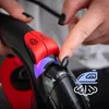 A close-up shot of a person's hands operating the controls of a steam iron. Voir les images du produit