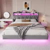 A modern bedroom with a gray upholstered bed featuring LED lighting. Produktbild-Vorschau
