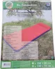 The image shows the retail packaging of an inflatable mattress, with the mattress itself partially visible on the grass next to a body of water. Produktbild-Vorschau